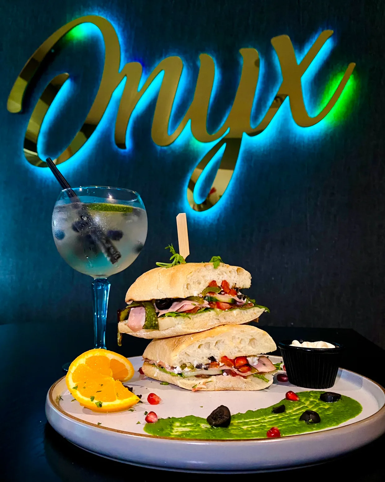 Dessert and cocktail with Onyx sign